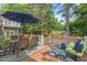 Relaxing outdoor deck with dining and lounge furniture, perfect for entertaining in a serene setting at 6304 Ansley Ln, Raleigh, NC 27612