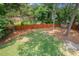 Overhead view of a large backyard with a fire pit and plenty of green space, perfect for outdoor activities at 6304 Ansley Ln, Raleigh, NC 27612