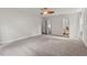 Large bedroom with carpet, and a closet with an open door, leading to an ensuite bathroom at 6304 Ansley Ln, Raleigh, NC 27612