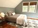 Comfortable bedroom features neutral color scheme, hardwood floors, and a window for natural light at 6304 Ansley Ln, Raleigh, NC 27612