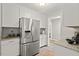Kitchen with stainless steel refrigerator and light countertops at 6304 Ansley Ln, Raleigh, NC 27612