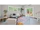 Finished basement with seating area, a large rug, and natural light at 6304 Ansley Ln, Raleigh, NC 27612