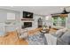 Cozy living room with hardwood floors, fireplace, and modern furnishings at 6304 Ansley Ln, Raleigh, NC 27612