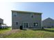Backyard featuring patio with chairs and grill at 6729 Osprey Landing Dr, Wendell, NC 27591