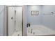 Spa-like bathroom featuring glass shower and soaking tub at 6729 Osprey Landing Dr, Wendell, NC 27591