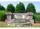 Stone community sign with Edgemont Landing inscription surrounded by tiered landscaping at 6729 Osprey Landing Dr, Wendell, NC 27591
