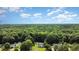 Aerial view of the property showing the home nestled within a lush green canopy at 701 Creekside Dr, Clayton, NC 27520