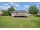 Spacious backyard with a large deck and a lush green lawn, perfect for outdoor activities at 701 Creekside Dr, Clayton, NC 27520