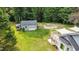 Backyard featuring a storage building and deck with awning off the main house at 701 Creekside Dr, Clayton, NC 27520