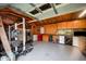 Garage interior featuring plywood walls, workbenches, and organized storage solutions at 701 Creekside Dr, Clayton, NC 27520