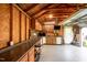 Garage interior featuring plywood walls, workbenches, and organized storage solutions at 701 Creekside Dr, Clayton, NC 27520