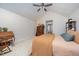Cozy main bedroom featuring a ceiling fan, plush carpet, and an antique writing desk at 701 Creekside Dr, Clayton, NC 27520