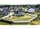 An elevated view showcases a spacious, fenced backyard with a playset and patio furniture at 77 Redpine Ct, Clayton, NC 27520