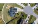 Aerial view of a home featuring a large, fenced backyard, a playset, and a patio set at 77 Redpine Ct, Clayton, NC 27520