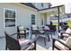 Backyard patio featuring dark outdoor seating with light cushions and an outdoor grill at 77 Redpine Ct, Clayton, NC 27520