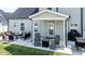 Backyard patio featuring outdoor seating, a fire pit, a barbecue grill, and neutral siding on the home at 77 Redpine Ct, Clayton, NC 27520