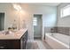 Bathroom with double sink vanity and soaking tub at 77 Redpine Ct, Clayton, NC 27520