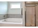 Bathroom featuring a soaking tub and walk in shower at 77 Redpine Ct, Clayton, NC 27520