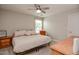 Cozy bedroom with natural light, ceiling fan, and comfortable furnishings, creating a relaxing atmosphere at 77 Redpine Ct, Clayton, NC 27520