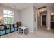 Bedroom with neutral walls, a dark brown doorway, and large windows for ample light at 77 Redpine Ct, Clayton, NC 27520