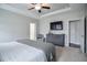 Primary bedroom featuring a ceiling fan, ensuite bath and walk-in closet at 77 Redpine Ct, Clayton, NC 27520