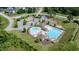 Aerial view of a community pool featuring separate pools for recreation and lap swimming surrounded by trees at 77 Redpine Ct, Clayton, NC 27520