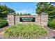 Stone entrance sign reading 'Winston Pointe' surrounded by lush greenery at 77 Redpine Ct, Clayton, NC 27520