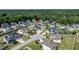A beautiful home with a manicured lawn and white picket fence sits in a neighborhood surrounded by lush trees at 77 Redpine Ct, Clayton, NC 27520