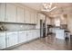 Bright kitchen features shaker cabinets, stainless steel appliances, granite counters and lots of storage at 77 Redpine Ct, Clayton, NC 27520