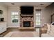 Living room with a stone fireplace and hardwood floors at 77 Redpine Ct, Clayton, NC 27520