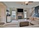 Living room featuring a stone fireplace, stairs, and comfortable sectional sofa at 77 Redpine Ct, Clayton, NC 27520