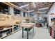 Spacious basement workshop featuring numerous tools, work benches and wooden storage shelves at 817 Stable Fern Dr, Fuquay Varina, NC 27526
