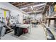 Spacious basement workshop with pegboard walls, worktables, and organized tool storage at 817 Stable Fern Dr, Fuquay Varina, NC 27526