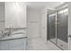 Bathroom with a double sink vanity and a glass enclosed shower at 817 Stable Fern Dr, Fuquay Varina, NC 27526