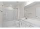 Bathroom featuring a shower over tub, vanity with storage, and white tile floor at 817 Stable Fern Dr, Fuquay Varina, NC 27526