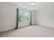 Light-filled bedroom with carpeted floors and large windows at 817 Stable Fern Dr, Fuquay Varina, NC 27526