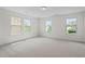 Spacious bedroom featuring three large windows providing natural light at 817 Stable Fern Dr, Fuquay Varina, NC 27526