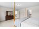 Bedroom with a four-poster bed frame and a dresser with a tri-fold mirror at 817 Stable Fern Dr, Fuquay Varina, NC 27526
