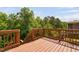 Expansive wooden deck with brown railings provides plenty of space for outdoor enjoyment at 817 Stable Fern Dr, Fuquay Varina, NC 27526