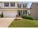 Charming two-story home with a well-manicured lawn, attached garage, and inviting front porch, creating curb appeal at 817 Stable Fern Dr, Fuquay Varina, NC 27526