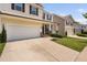 Well-maintained two-story home with an attached garage and manicured lawn in a quiet, residential neighborhood at 817 Stable Fern Dr, Fuquay Varina, NC 27526