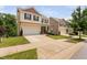 Two-story home featuring a spacious driveway, well-maintained lawn, and classic design, in a suburban setting at 817 Stable Fern Dr, Fuquay Varina, NC 27526