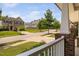 Charming front porch view of the neighborhood street with trees and well-maintained homes, perfect for relaxing outdoors at 817 Stable Fern Dr, Fuquay Varina, NC 27526