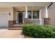 Welcoming front porch with classic brick accents, crisp white columns, and an inviting entrance to 817 at 817 Stable Fern Dr, Fuquay Varina, NC 27526