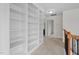 Hallway featuring built-in shelving and access to multiple rooms at 817 Stable Fern Dr, Fuquay Varina, NC 27526