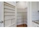 Walk-in pantry with built-in shelving for efficient storage and organization of kitchen essentials at 817 Stable Fern Dr, Fuquay Varina, NC 27526