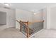 Second floor hallway featuring wrought iron and wood staircase at 817 Stable Fern Dr, Fuquay Varina, NC 27526