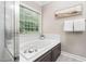 Bright bathroom featuring a soaking tub, glass enclosed shower, and neutral tones at 8201 Ivymount Way, Raleigh, NC 27613