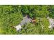 Aerial view of a home featuring a deck, a backyard and surrounded by mature trees at 8508 Zinfandel Pl, Raleigh, NC 27615