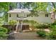 Rear exterior reveals a deck and yard, surrounded by meticulously maintained landscaping at 8508 Zinfandel Pl, Raleigh, NC 27615